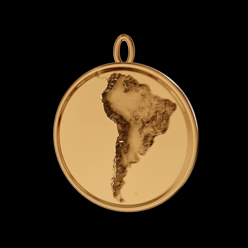 Yellow gold round pendant with South America's coastlines and terrain sculpted into its face